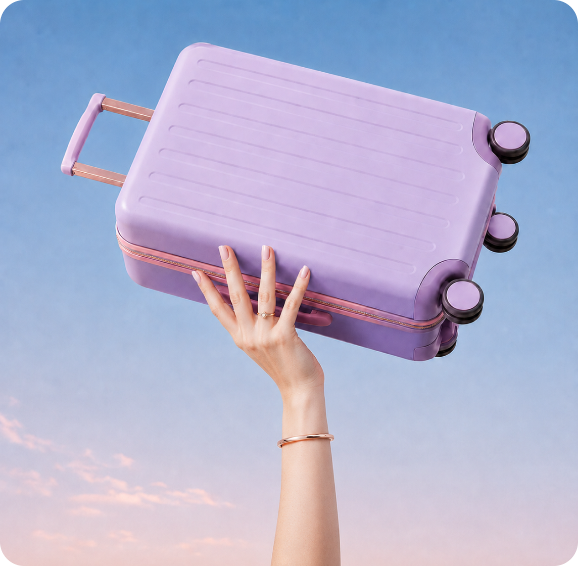 Hand holding a purple hardshell suitcase against a sunset sky