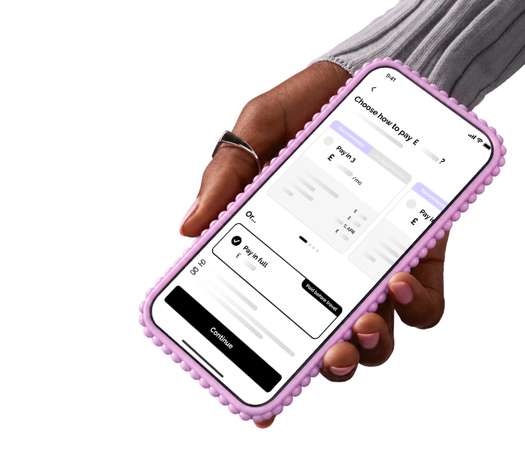 Hand holding a phone showing the Vuelo Pay in full checkout screen
